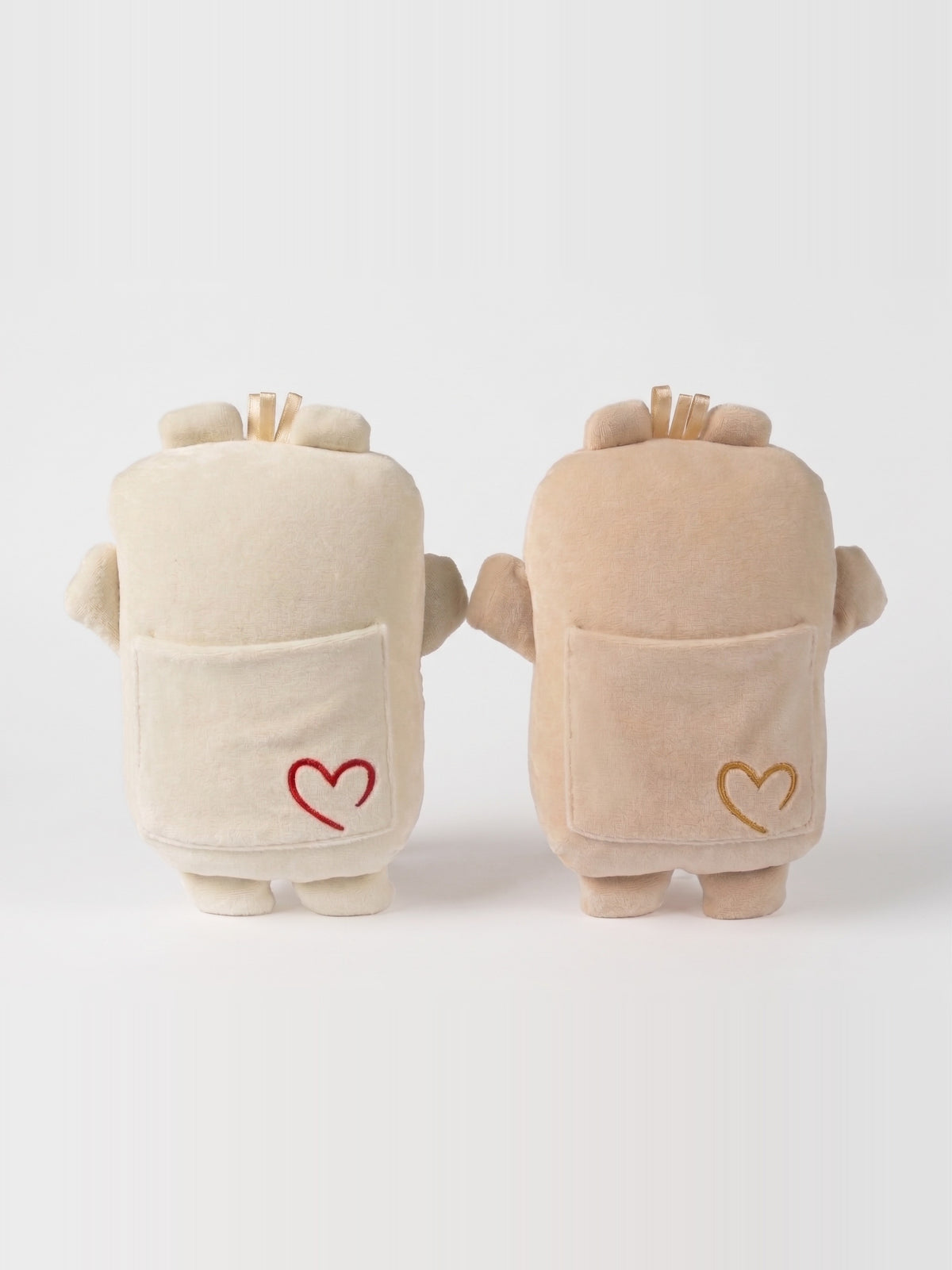 Mini Bippie in Cannoli Cream and Lamb's Wool, back, showing the hidden pocket and embroidered heart