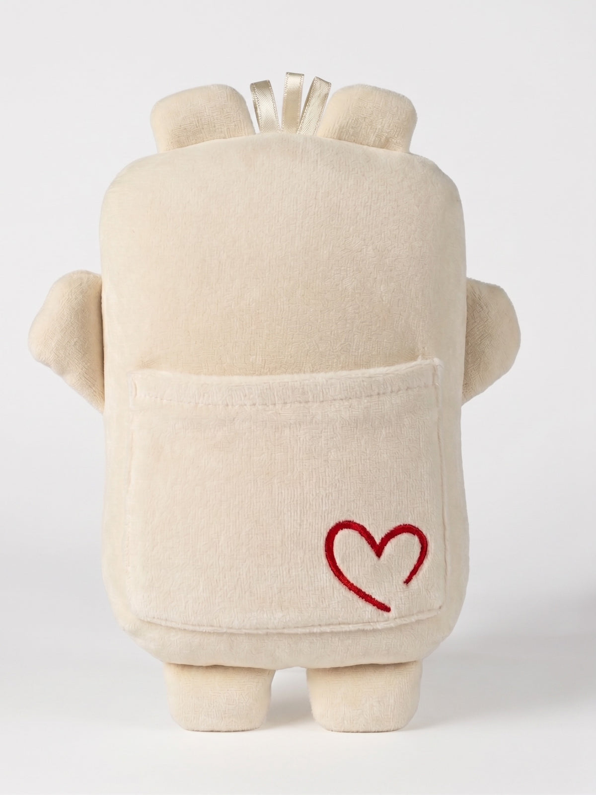 Mini Bippie comfort companion in Cannoli Cream, back, on white